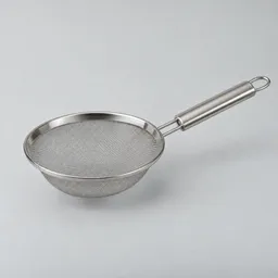 Centered stainless-steel fine-mesh sieve with a round bowl, tightly woven mesh, and straight handle on a light neutral background.