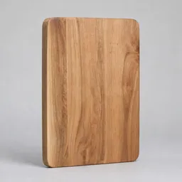 Centered rectangular wooden cutting board photographed against a plain light background.