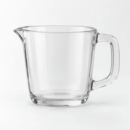Centered transparent measuring cup with a handle and pouring spout on a neutral light background.