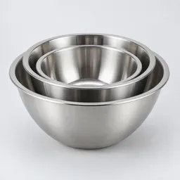 Centered set of three nested stainless-steel mixing bowls on a light neutral background.