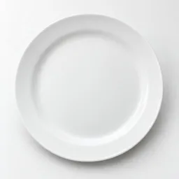 Centered studio photograph of a plain glossy white ceramic dinner plate on a light neutral background.