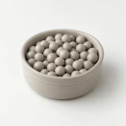 A complete set of smooth gray ceramic pie weights arranged in a compact cluster on a light neutral background.