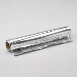 Centered unbranded roll of aluminum foil on a light neutral background.