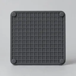 A centered charcoal-gray silicone kitchen trivet with a raised grid pattern on a neutral light background.