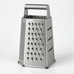 Centered stainless-steel box grater photographed upright on a neutral light background.