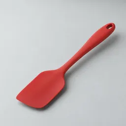 Centered heat-resistant silicone spatula on a neutral light background, fully visible with generous margins.