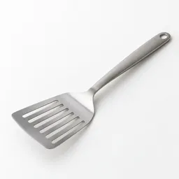 A centered stainless-steel fish spatula with a broad slotted turner head and plain handle on a light neutral background.