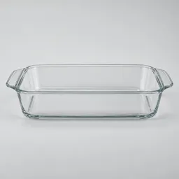 Centered clear glass 2-quart rectangular baking dish on a neutral light background.