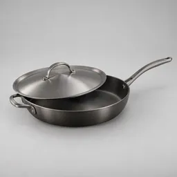 Centered 12-inch dark metal skillet with matching lid on a neutral light background.