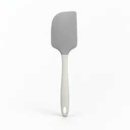 Centered flexible silicone spatula photographed fully in frame on a neutral light background.