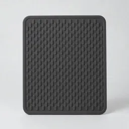 Centered charcoal silicone heatproof trivet on a neutral light background.