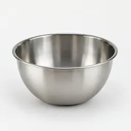 Centered medium stainless-steel mixing bowl on a light neutral background.