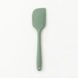 Centered unbranded silicone spatula photographed on a light neutral background.