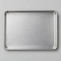 Centered realistic studio photograph of a plain rectangular rimmed aluminum sheet pan on a neutral light background.