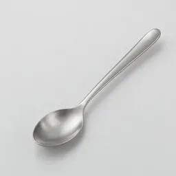 A centered stainless steel stirring spoon on a neutral light gray studio background.