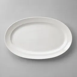 A plain white oval ceramic serving platter photographed centered on a light neutral background.