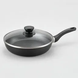 Centered 10-inch nonstick skillet with matching glass lid on a neutral light background.