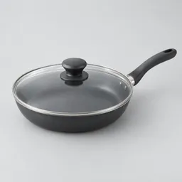 Centered unbranded 12-inch nonstick skillet with a transparent glass lid on a neutral light background.