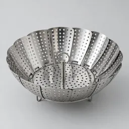 Centered stainless-steel collapsible steamer basket with perforated folding petals on a light neutral background.