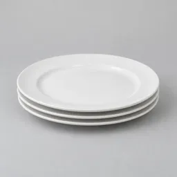 Centered stack of three plain white ceramic dinner plates on a light neutral background.