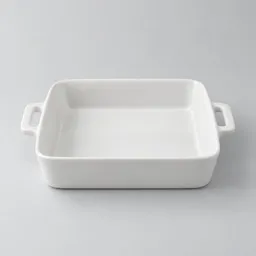 Centered 8-inch square white ceramic baking dish on a light neutral background.