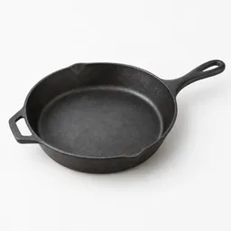 Centered 10-inch dark cast-iron oven-safe skillet on a light neutral background.