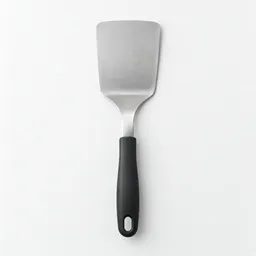 Centered wide stainless-steel kitchen spatula with a dark handle on a neutral light background.