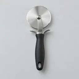Centered stainless-steel pizza cutter with a round cutting wheel and matte black handle on a light neutral background.