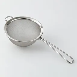 Centered stainless-steel kitchen sieve with fine mesh and a straight handle on a neutral light background.