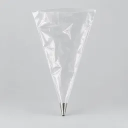 Centered transparent pastry piping bag with a plain stainless-steel nozzle on a light neutral background.