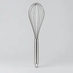 Centered stainless-steel balloon whisk on a light neutral background.