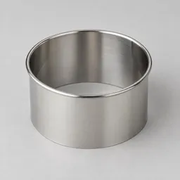 Centered stainless-steel 3-inch round kitchen cutter on a light neutral background.