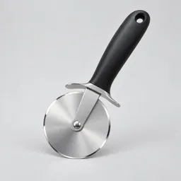 Centered stainless-steel pizza wheel with a dark handle photographed against a plain light gray studio background.