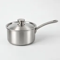 Small metal cooking pot with lid and side handle, centered on a neutral light background.