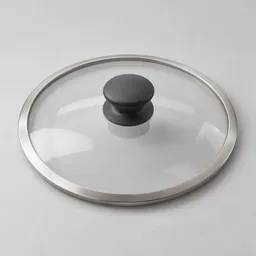 Centered unbranded glass kitchen pot lid with a brushed-metal rim and dark central knob on a light neutral background.