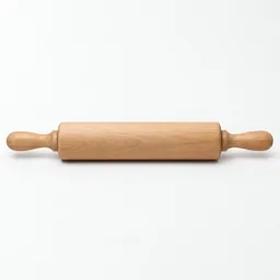Centered wooden rolling pin on a light neutral background.