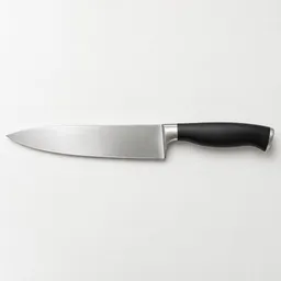 A single plain-handled stainless-steel kitchen knife centered on a light neutral studio background.